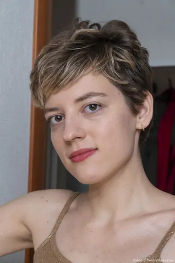Amateur with Big Tits Spreads Her Hairy Pussy in a Doorway