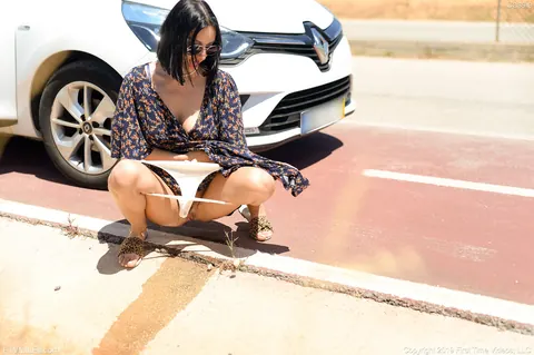 Brunette Drops Her Panties and Pisses Beside the Road – photo 14 of 20