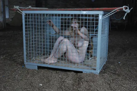 Busty Naked Slave Chained and Spreads Her Pussy Wide – photo 16 of 16