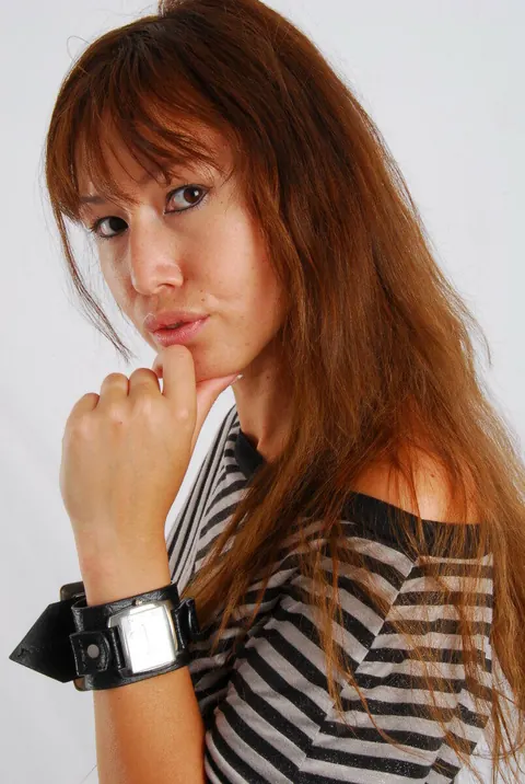 Asian Redhead Checks Her Watch While Posing in Shorts – photo 13 of 16