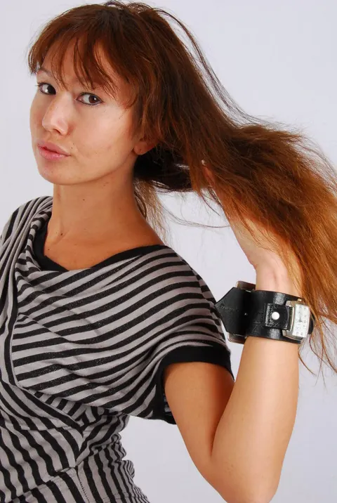 Asian Redhead Checks Her Watch While Posing in Shorts – photo 7 of 16