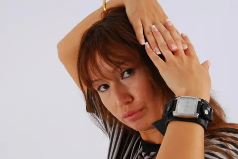 Asian Redhead Checks Her Watch While Posing in Shorts – photo 15 of 16