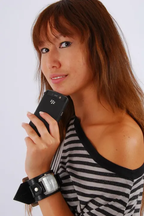 Asian Redhead Checks Her Watch While Posing in Shorts – photo 3 of 16
