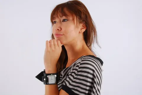 Asian Redhead Checks Her Watch While Posing in Shorts – photo 6 of 16