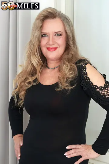 Mature Blonde BBW Sheds Her Dress and Spreads in the Bedroom