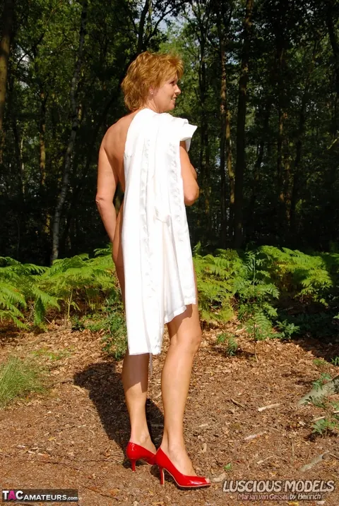 European Redhead MILF Shows Her Big Tits in the Woods – photo 14 of 16