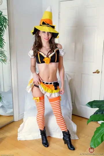 Skinny Brunette in Witch Costume and Stockings Bares Her Holes