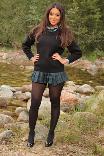 Busty Brunette Strips Out of Her Pantyhose by the River