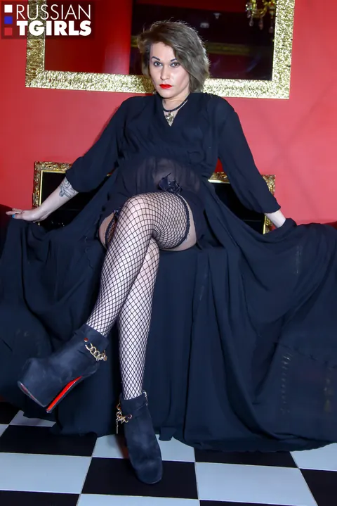 Trans Woman in Fishnets Toys Her Ass and Strokes Her Cock – photo 2 of 16