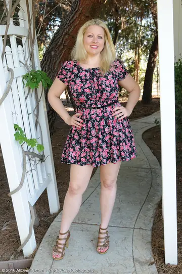 Blonde MILF in a Skirt and Thong Spreads in the Garden