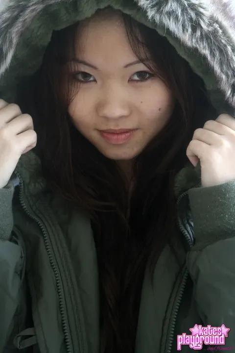 Asian Brunette Opens Winter Coat to Reveal Thong – photo 9 of 12