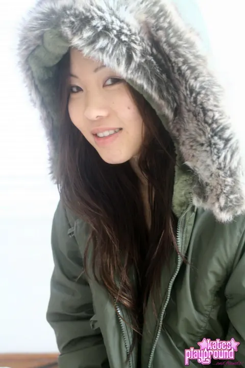 Asian Brunette Opens Winter Coat to Reveal Thong – photo 6 of 12