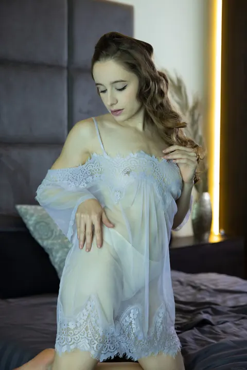 Brunette Slips Off Her Panties and Fingers Her Shaved Pussy – photo 2 of 21