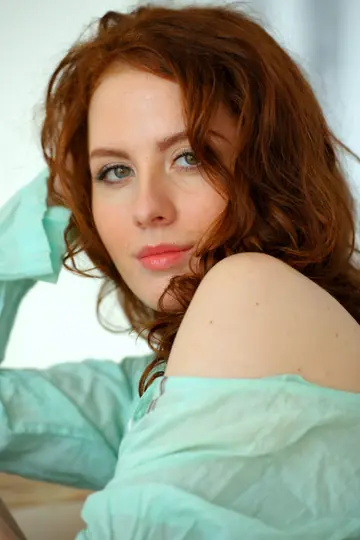 Curly Redhead Undresses and Shows Her Trimmed Pussy