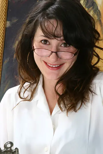 MILF in Glasses Poses Nude and Shows Her Body