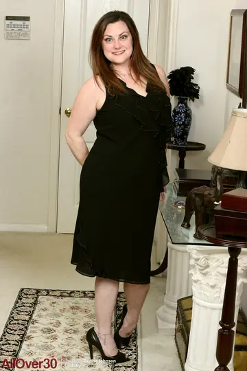 Busty Brunette MILF in a Skirt Lifts Her Hem and Spreads Her Hairy Pussy
