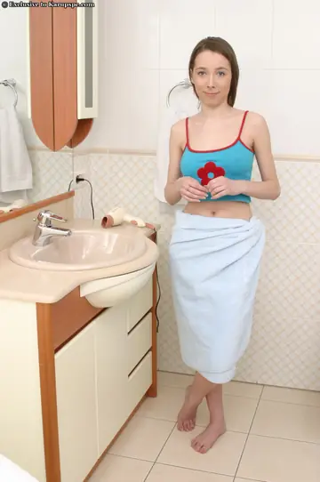 Slim Busty Woman Fingers Her Hairy Pussy in the Bathroom