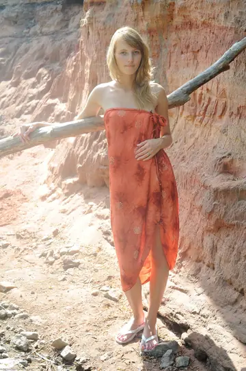 Nasir – Blonde Strips Out of Her Skirt and Poses Naked Outdoors