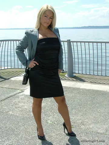 Blonde PAWG Strolls the Beach in a Black Dress and High Heels