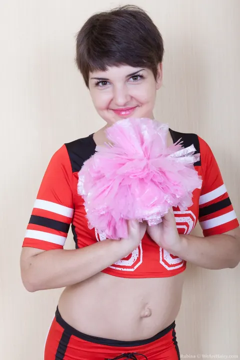 Rubina: Short-Haired Brunette in Cosplay Uniform Strips and Spreads Her Hairy Pussy – photo 1 of 18