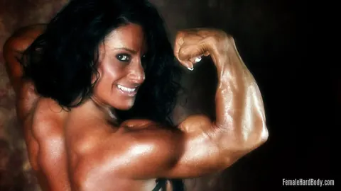 Debbie Bramwell: BBW Brunette Bodybuilder Flexes in a Thong and Skirt – photo 10 of 15