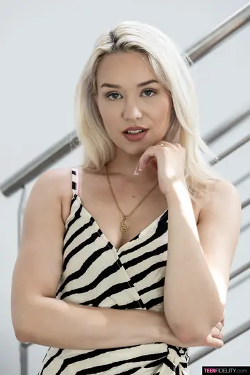 Blonde Strips Out of Her Dress and Lingerie to Show Her Shaved Pussy