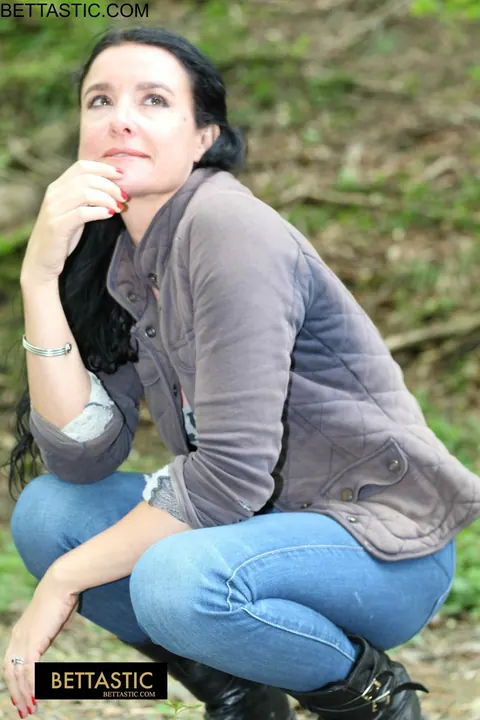 Brunette Poses Outdoors in Jeans and Turns Around – photo 12 of 15
