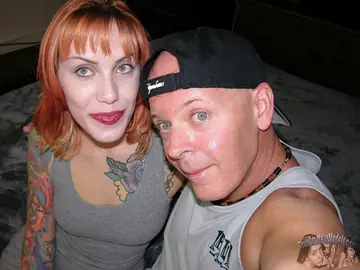 Tattooed Redhead Gives a Handjob Until He Cums on Her Ass