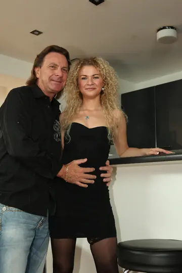 Curly German Blonde in Stockings Sucks and Fucks Her Client