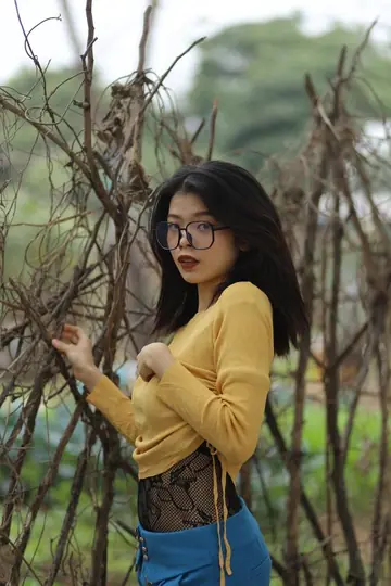 Asian Woman in Pantyhose and Glasses Teases Outdoors