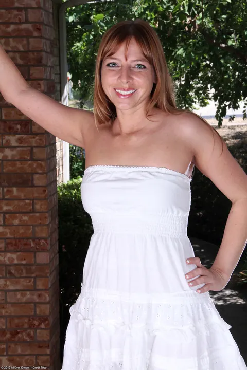 Tall Redhead MILF Strips Out of Her Dress Outdoors – photo 2 of 21