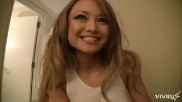 Tila Tequila – Slim Asian MILF in Shorts Sucks Finger and Shows Panties