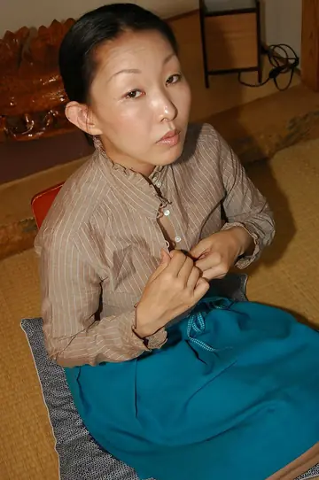 Hairy Japanese Woman Fingers Her Pussy in the Bathroom