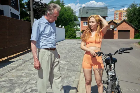 Jessi Sour: Redhead in Shorts Rides Bicycle Then Gives a Blowjob Outdoors – photo 3 of 16