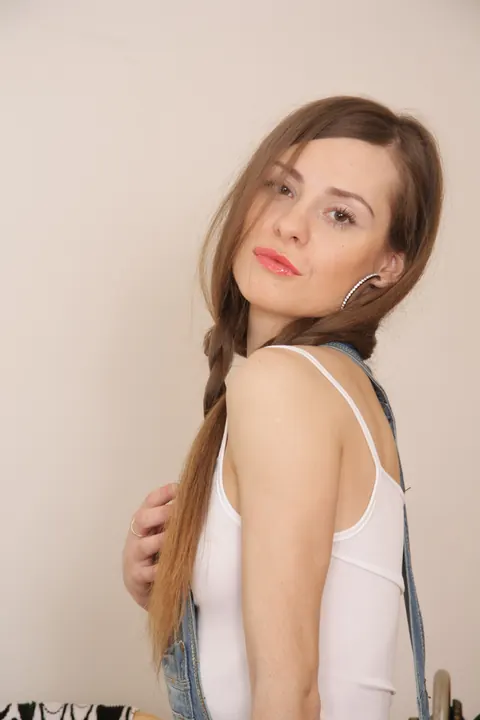 Woman with Pigtails Strips Out of Her Skirt While Sewing – photo 3 of 20