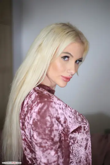 Blonde with Enhanced Tits Spreads Her Pussy