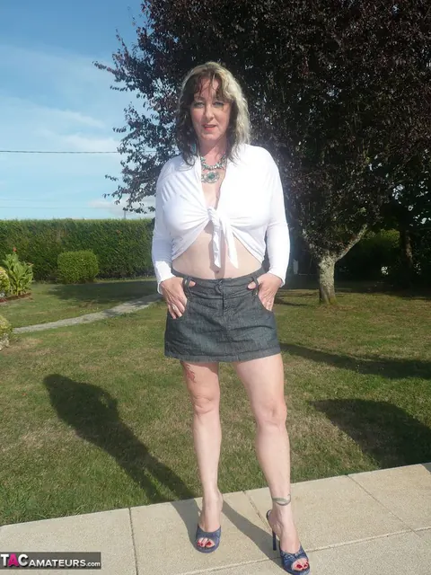 Busty MILF in a Skirt Spreads Her Pierced Pussy Outdoors – photo 1 of 20