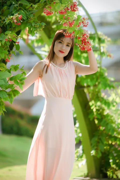 Asian Woman Poses in a Dress Outdoors – photo 12 of 21