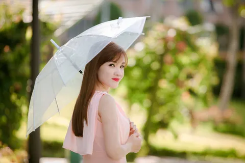 Asian Woman Poses in a Dress Outdoors – photo 18 of 21