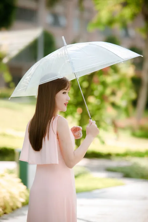 Asian Woman Poses in a Dress Outdoors – photo 20 of 21