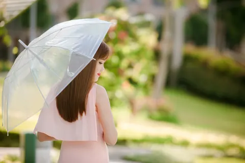 Asian Woman Poses in a Dress Outdoors – photo 15 of 21