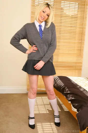 Busty Blonde with Short Hair Poses in Stockings and Heels