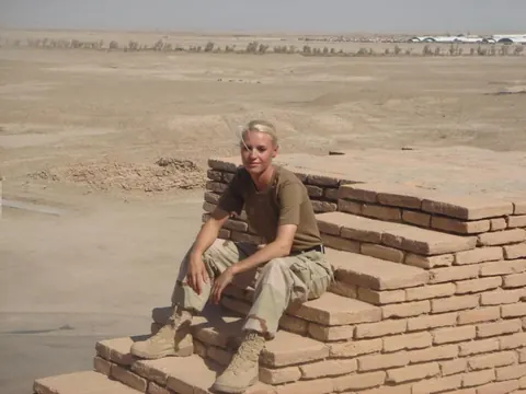 Blonde in a Military Uniform Strips Nude and Poses – photo 13 of 15