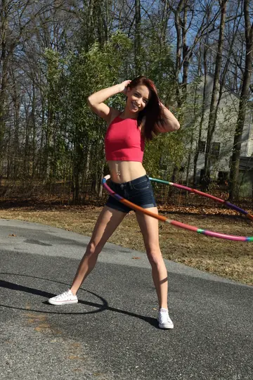 Redhead in Shorts Spreads Her Shaved Pussy at the Gym