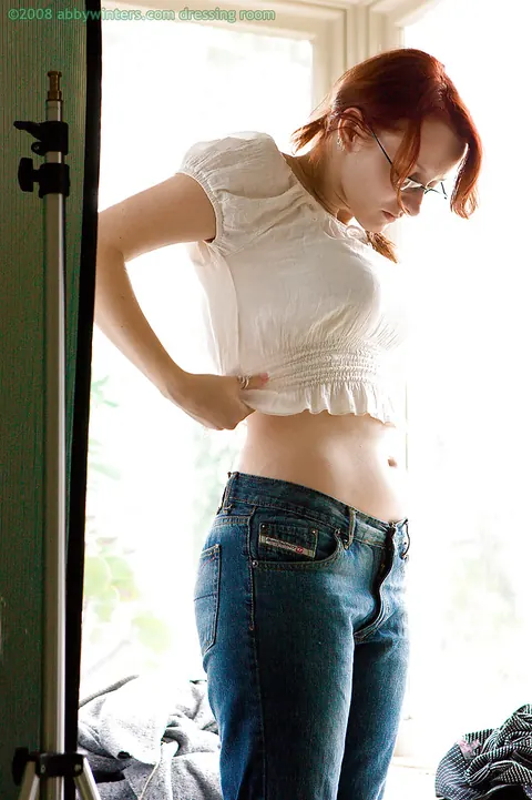 Thick Busty Redhead in Glasses Poses Nude Then Pulls on Panties and Jeans – photo 15 of 16