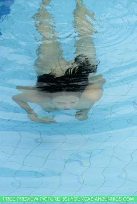 Thick Asian Babe Strips Out of Her Bikini in the Pool – photo 13 of 16
