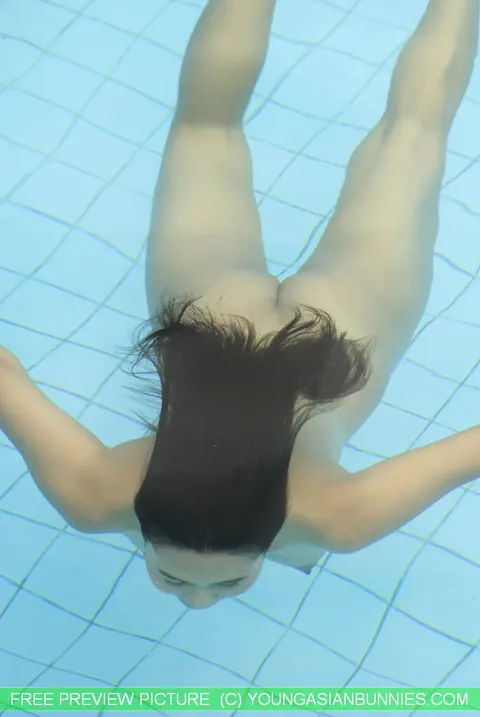 Thick Asian Babe Strips Out of Her Bikini in the Pool – photo 15 of 16