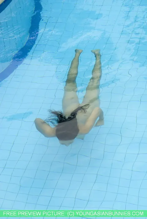 Thick Asian Babe Strips Out of Her Bikini in the Pool – photo 14 of 16