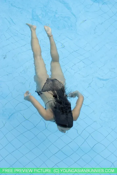 Thick Asian Babe Strips Out of Her Bikini in the Pool – photo 16 of 16