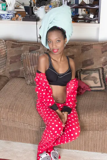 Skinny Ebony Babe with Short Hair Poses Nude in the Bathroom